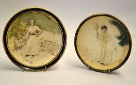 Pair of Vic tennis coloured wall plates - moulded in relief with a male and female tennis player