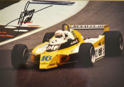 Formula One Motor Racing - 2x signed Formula 1 racing colour press photographs to incl Eddie