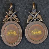 2x 1936 bronzed engraved golfing medals - mounted with crossed golf clubs and banner engraved 