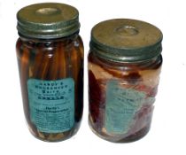 PRESERVED BAITS: (2) Pair of early Hardy glass bottled preserved baits, being Sand Eels and