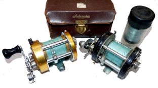REELS: (2) Abu Ambassadeur 6000C black multiplier reel, foot stamp 037100, 3 screw grooved end