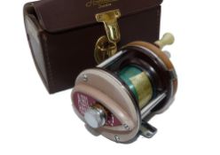 REEL: Abu Sweden 3000 multiplier reel, brown coffee colours foot stamp 080402, twin white handles on