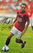 Dimitar Berbatov signed colour photograph in Manchester United colours, overall 45.5. x 35.5cm,