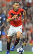 Ryan Giggs signed colour photograph in Manchester United colours, overall 35.5 x 45.5cm, mfg.