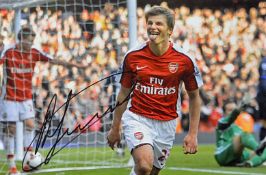Andrey Arshavin signed photograph in Arsenal colours, overall 45.5 x 35.5cm, mfg.