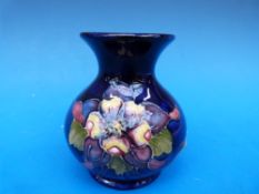 A Moorcroft vase in Freesia pattern, hei