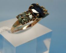 A yellow metal ring set with a central s