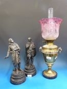 A brass urn shaped oil lamp together wit