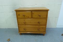 A pine chest of two over two drawers (wi