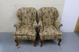 WITHDRAWN A pair of Queen Anne style wing backed a