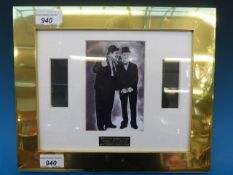 A framed Laurel and Hardy photograph and