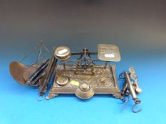 A set of ornate brass postal scales, fur