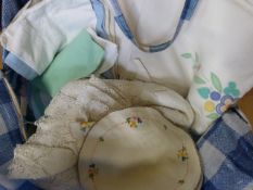 A quantity of vintage tablecloths etc
