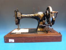 Three cased sewing machines including Fr
