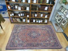 A blue & red ground Persian rug with sty