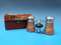 A pair of theatre glasses with snakeskin