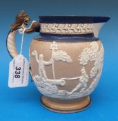 A 19thC relief moulded jug decorated wit