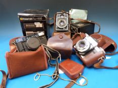 A collection of vintage cameras to inclu
