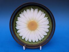 A ceramic Vienna coaster with pierced me