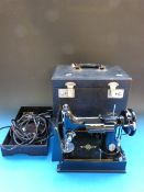 A cased brass microscope with a selectio