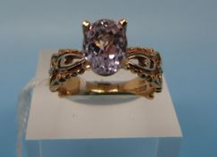 A 14k gold ring set with a large Kunzite