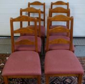 Six dining room chairs with upholstered
