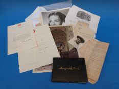 An autograph book, signatures include Ji