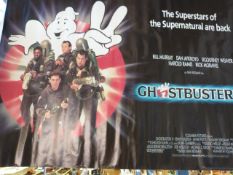 Two film posters Ghostbusters and Smurfs