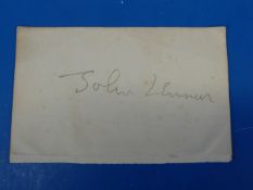 A John Lennon signature in pencil on the