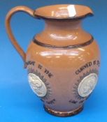 A Doulton Lambeth jug, decorated with mo