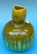 A Burmantofts Pottery green glazed vase,