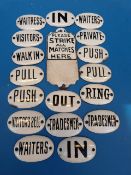 Approximately 20 enamel labels including