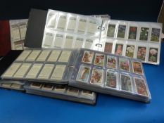 Four albums of cigarette cards, mainly 1