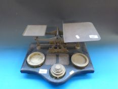 A set of postal scales with wooden base