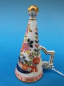 A Meissen candle snuffer decorated in th