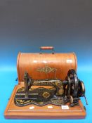 A Singer portable hand sewing machine (i