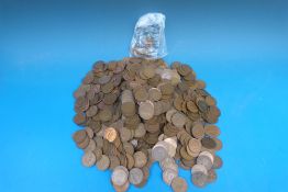 A tin of pre-decimal English copper half