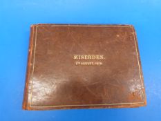 A leather bound scrap book or album, the
