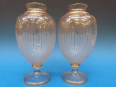 A pair of Baccarat glass mantel vases wi