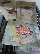 A crate of c1930's cigarette card albums
