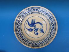 An 18thC Delft bowl with bird and flower