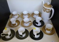 Six Susie Cooper Wedgwood cups and sauce