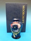 A Moorcroft vase in the Pansy pattern, h