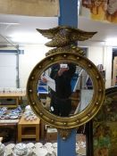 A pair of Regency style mirrors with eag