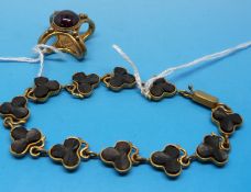 A yellow metal bracelet with jet inset c
