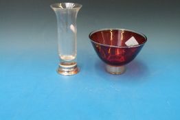 A glass vase with flared lip on millenni