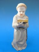 A candle snuffer in the form of a monk,