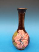 A Moorcroft vase in Hibiscus pattern, he