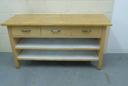 A modern beech sideboard fitted three dr