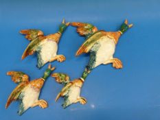 A run of four Beswick ducks, marked 596,